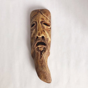 Old man carved mask