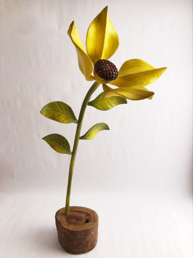 Sunflower flower carved in wood